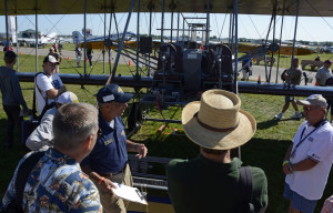 Wright B Flyer President Jay Jabour (with clipboard) tells homebuilders how they can help build the next Wright B Flyer. The airplane is on display on Vintage Square at EAA AirVenture 2015.